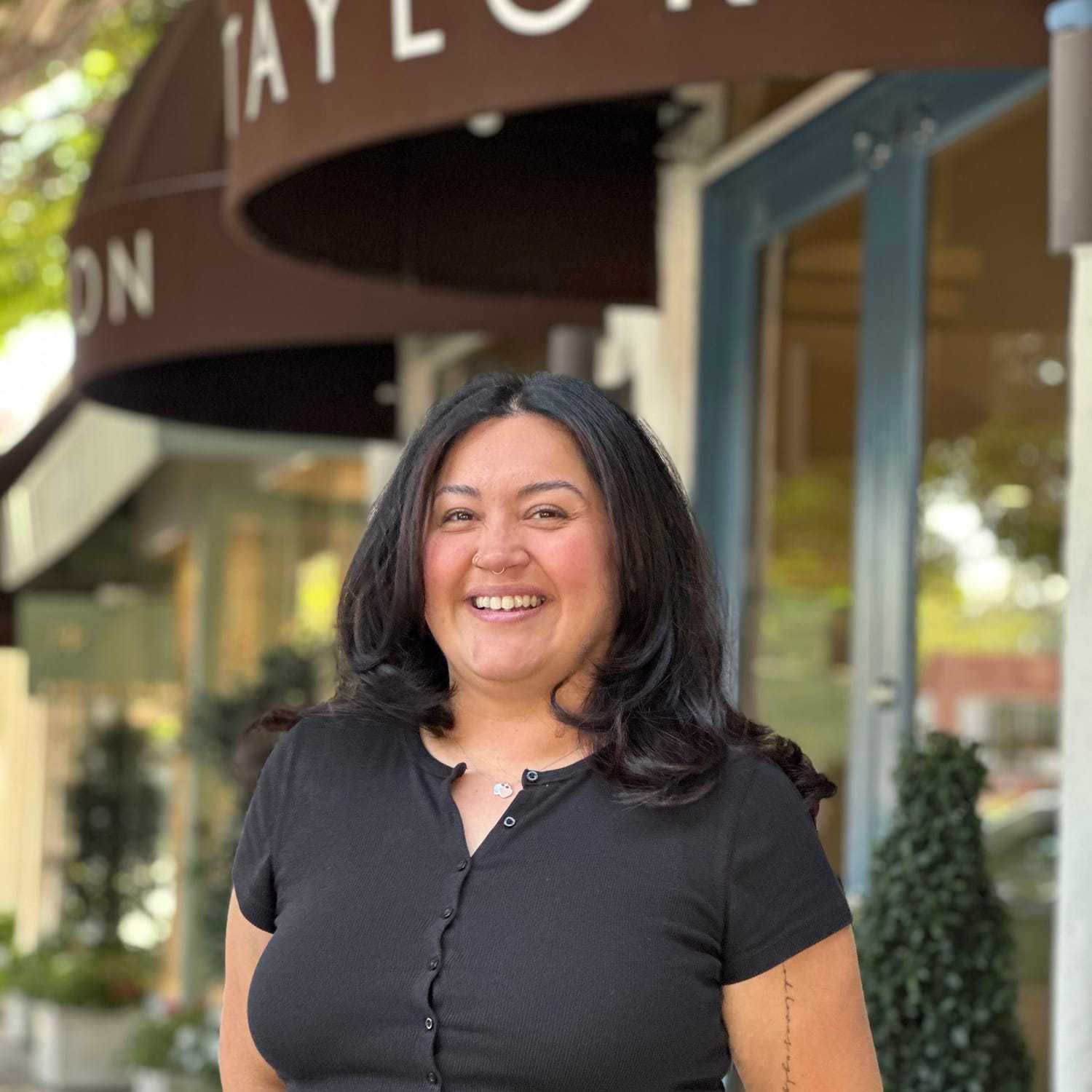 Portrait of Liliana Garcia, a professional stylist at Mark Taylor Salon & Spa, showcasing their expertise and style.