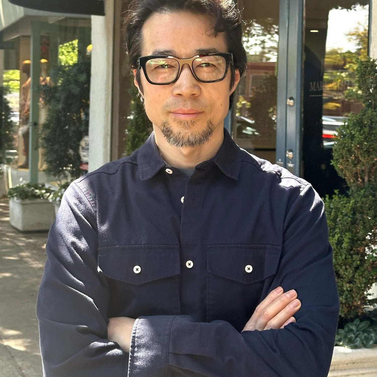 Portrait of Jerry Wang, a professional stylist at Mark Taylor Salon, showcasing their expertise and style.