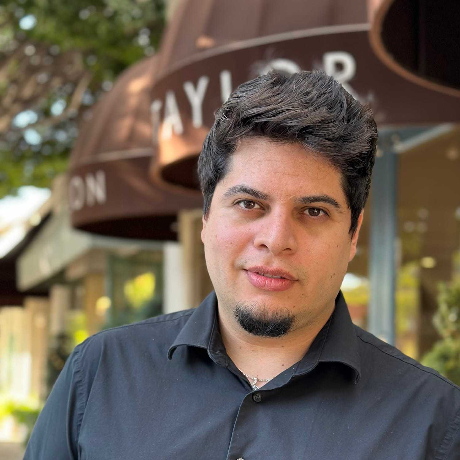 Portrait of Steven Rene, a professional stylist at Mark Taylor Salon & Spa, showcasing their expertise and style.