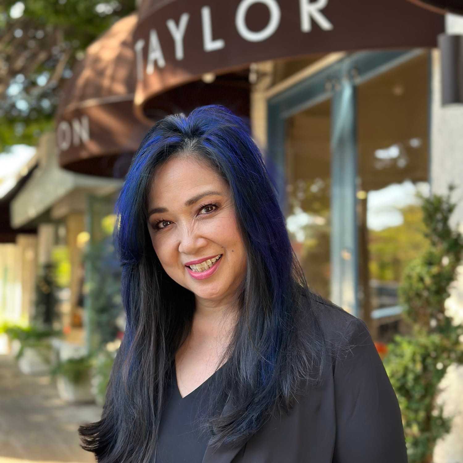 Portrait of Leslie Ung, a professional stylist at Mark Taylor Salon & Spa, showcasing their expertise and style.