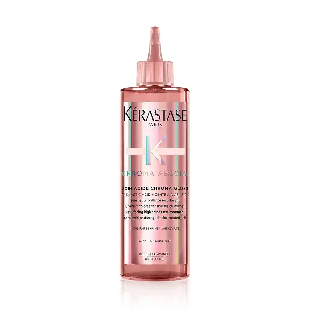 Kerastase Chroma Absolu hair gloss bottle with pink label and pointed cap.