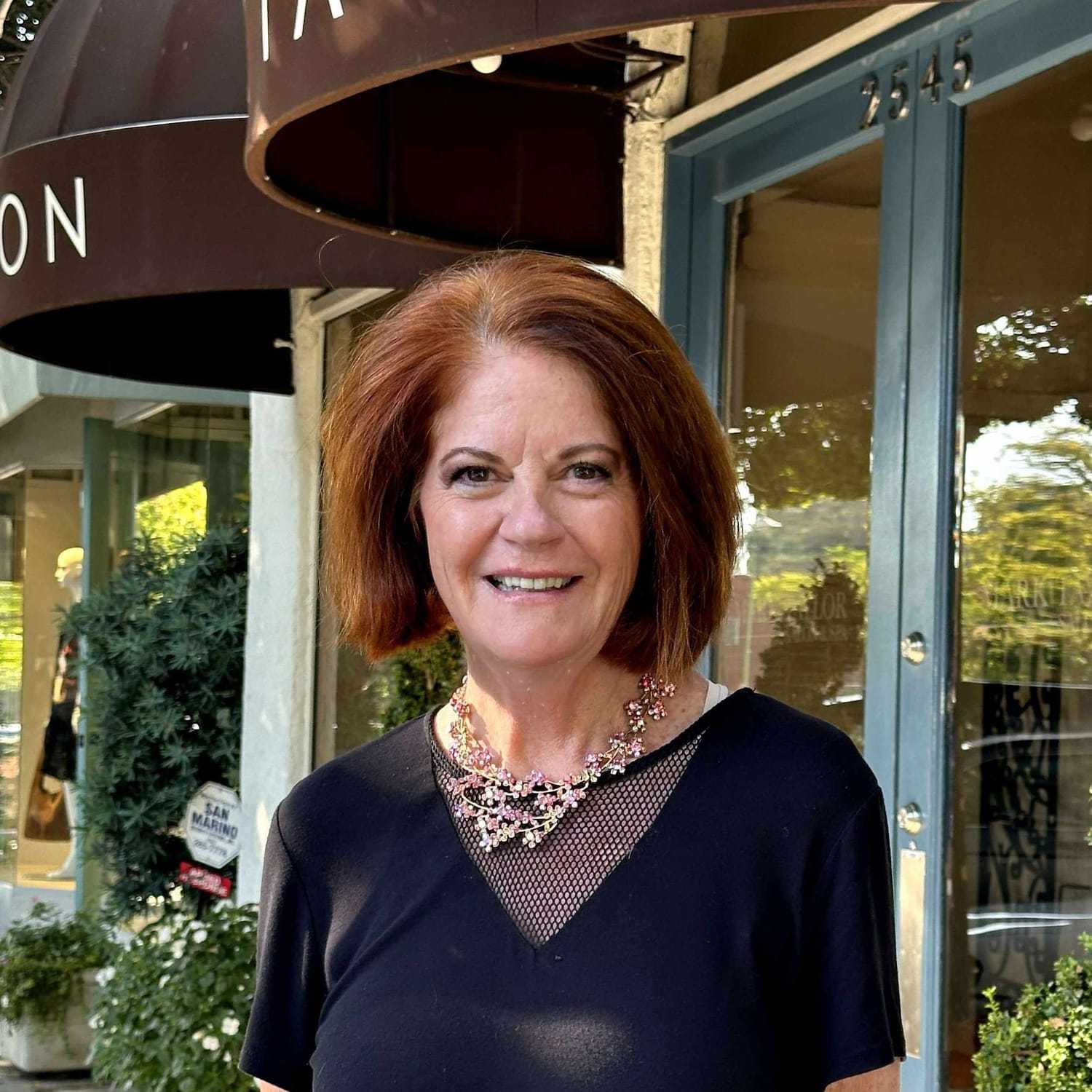 Portrait of Vickie Lanzarotta, a professional stylist at Mark Taylor Salon, showcasing their expertise and style.