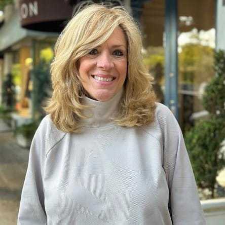 Portrait of Vickie Devaud, a professional stylist at Mark Taylor Salon & Spa, showcasing their expertise and style.