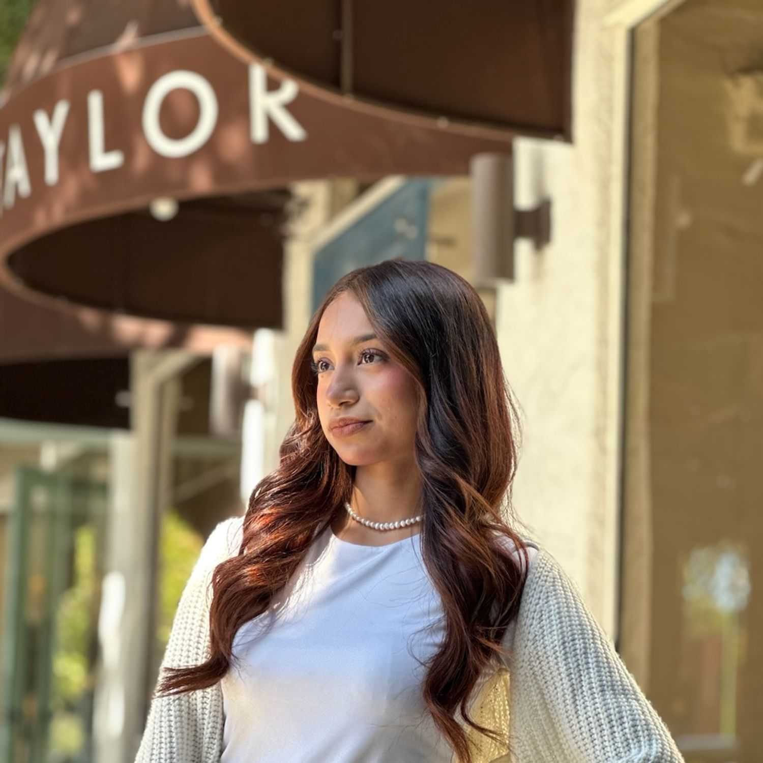 Portrait of Saray Vega, a professional stylist at Mark Taylor Salon, showcasing their expertise and style.