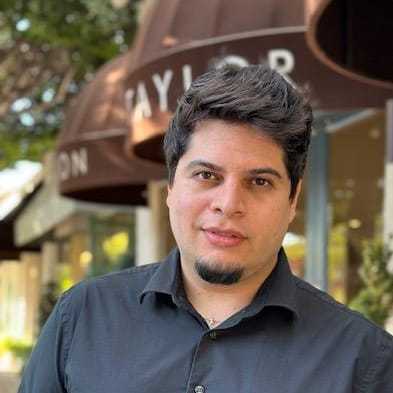 Portrait of Steven Rene, a professional stylist at Mark Taylor Salon & Spa, showcasing their expertise and style.