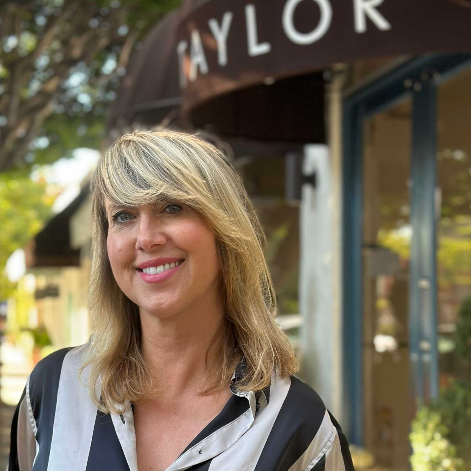 Portrait of Erica McAdams, a professional stylist at Mark Taylor Salon & Spa, showcasing their expertise and style.