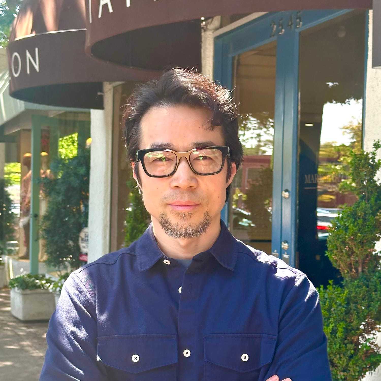 Portrait of Jerry Wang, a professional stylist at Mark Taylor Salon & Spa, showcasing their expertise and style.