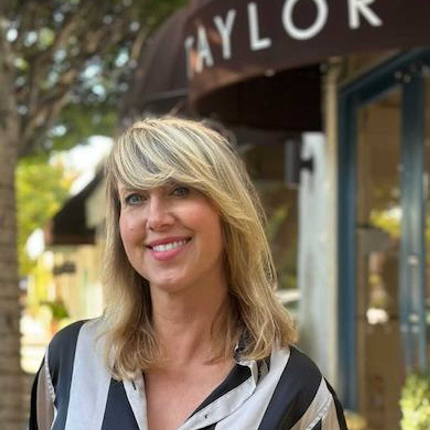 Portrait of Erica McAdams, a professional stylist at Mark Taylor Salon, showcasing their expertise and style.