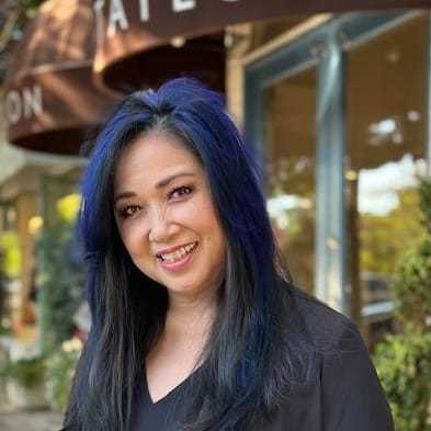 Portrait of Leslie Ung, a professional stylist at Mark Taylor Salon & Spa, showcasing their expertise and style.
