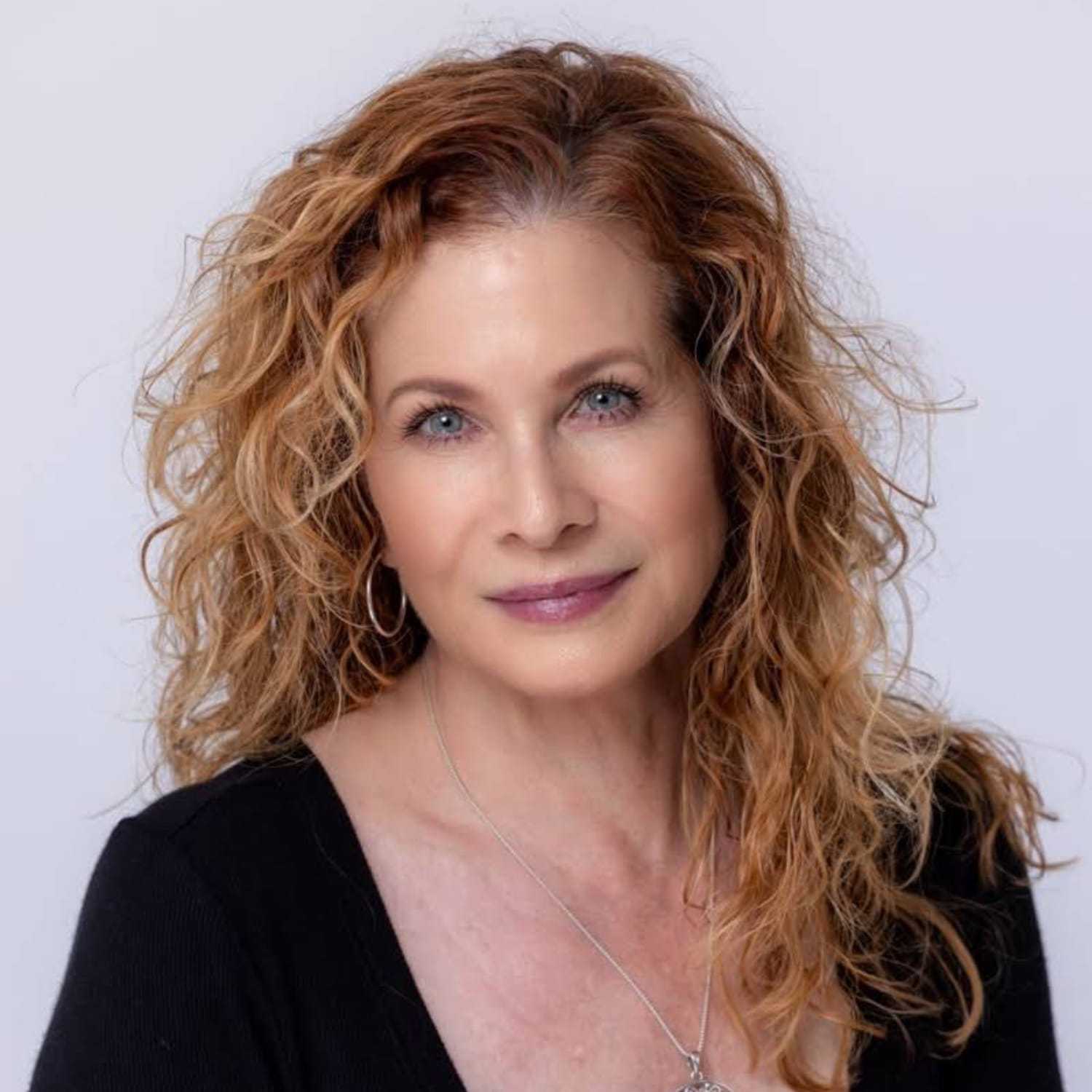 Portrait of Lynette Lyall, a professional stylist at Mark Taylor Salon & Spa, showcasing their expertise and style.