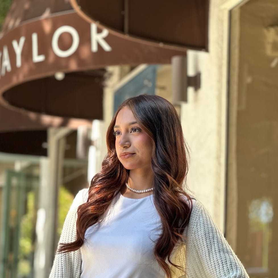 Portrait of Saray Vega, a professional stylist at Mark Taylor Salon & Spa, showcasing their expertise and style.