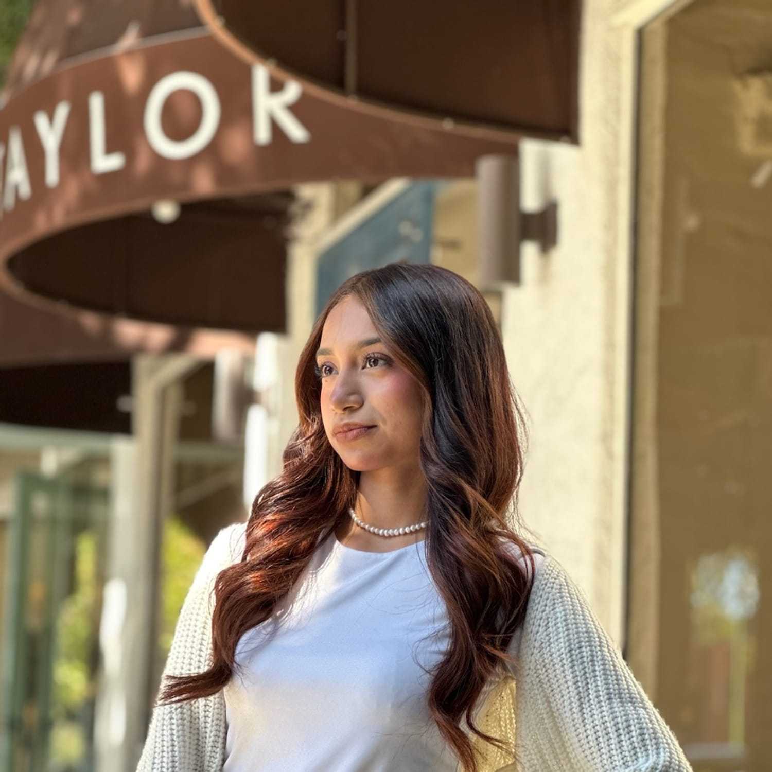Portrait of Saray Vega, a professional stylist at Mark Taylor Salon & Spa, showcasing their expertise and style.